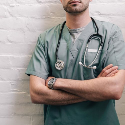 male-doctor-standing-with-arms-crossed